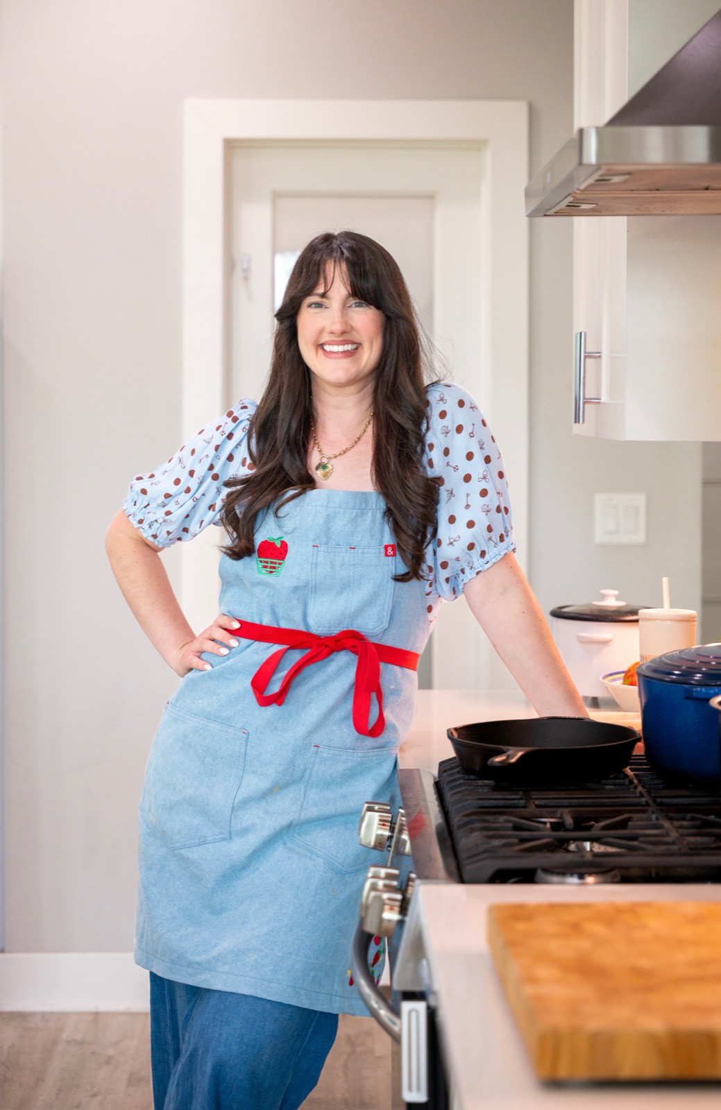 Haley Herridge, smiling in her kitchen